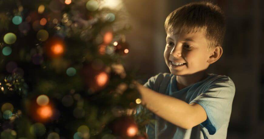 Boy Decorating Christmas Tree