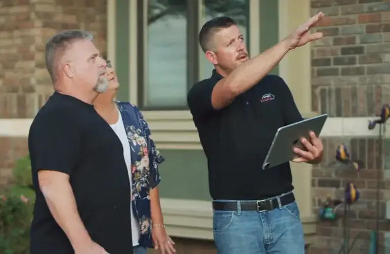 Man pointing to house